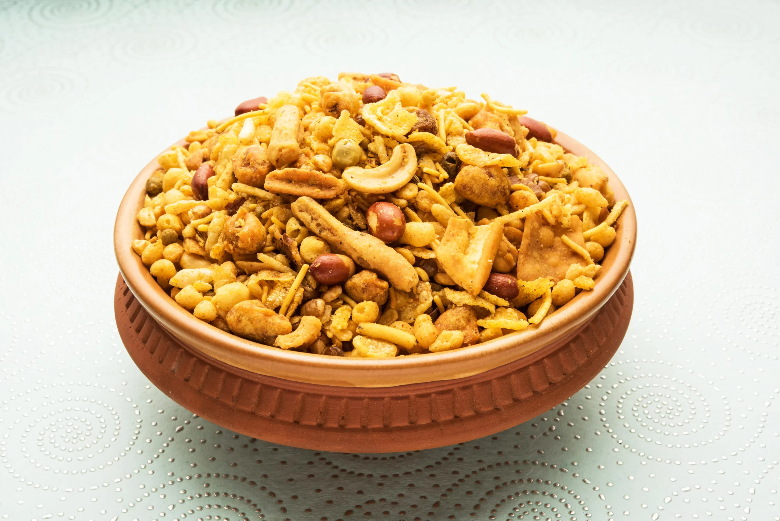 traditional-indian-deep-fried-salty-dish-chivda-mixture-farsan-farsaan-made-gram-flour-mixed-with-dry-fruits-served-bowl-plate-min